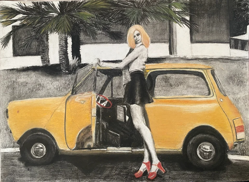 A woman beside a yellow car in a city street