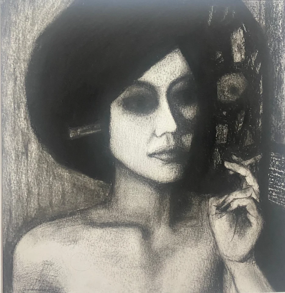 Monochrome portrait of a woman wearing a wide black hat
