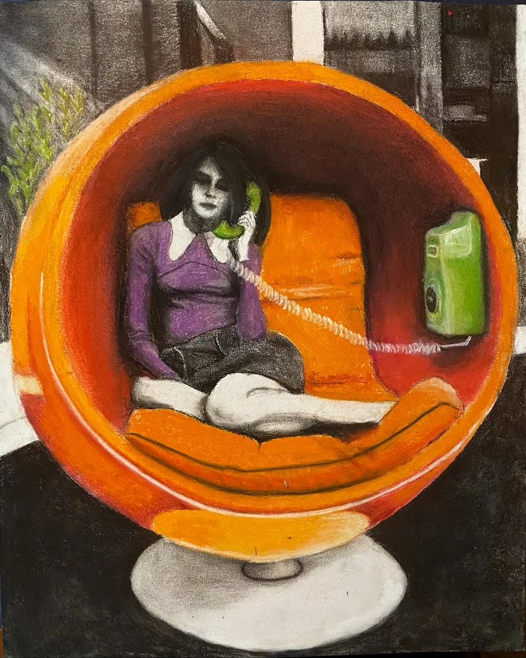 A reclining figure inside an orange circular chair