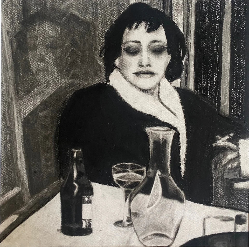 Monochrome portrait of a seated woman at a table