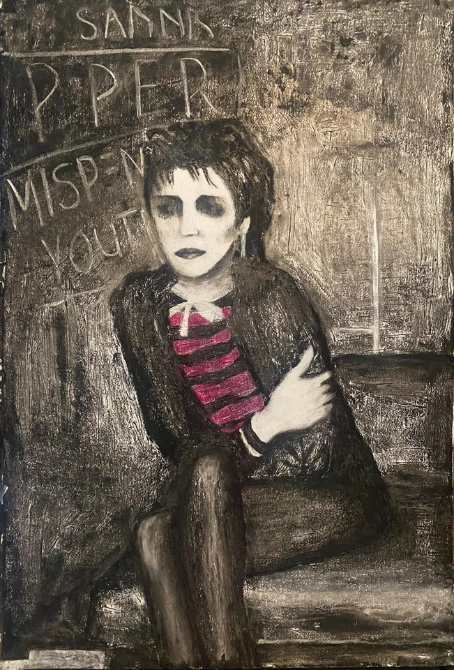 A seated figure wearing red stripes in a muted interior
